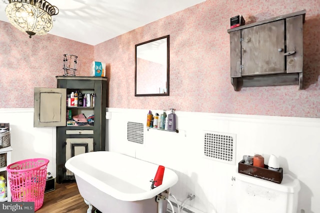 bathroom featuring a bath and wood-type flooring