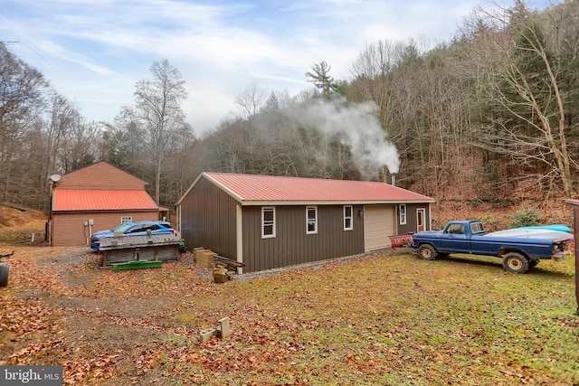 view of home's exterior with an outdoor structure