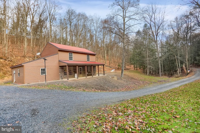 back of house with covered porch