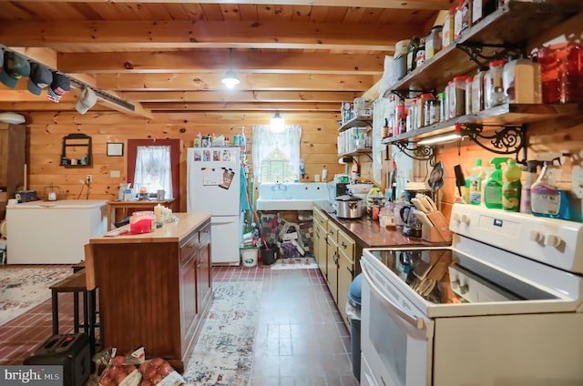 kitchen featuring white appliances, a kitchen island, wooden ceiling, and wood walls