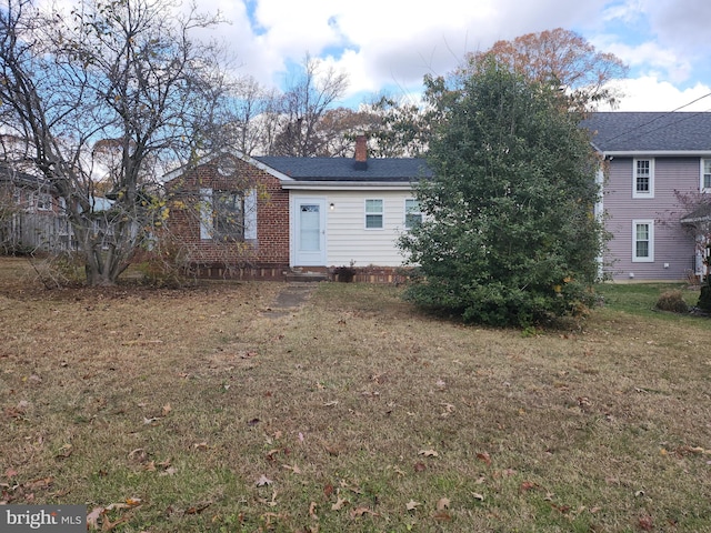 exterior space featuring a front lawn