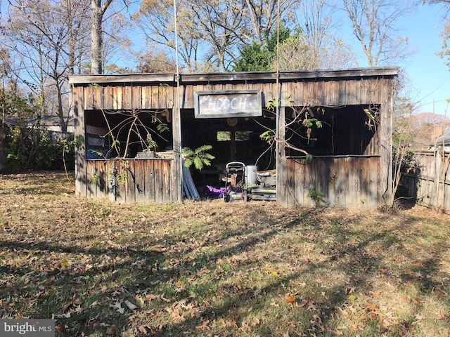 view of outdoor structure with a lawn