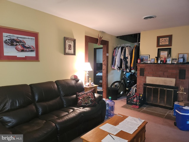 carpeted living room featuring a fireplace