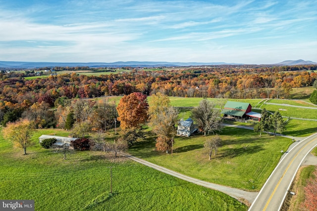 drone / aerial view featuring a mountain view and a rural view