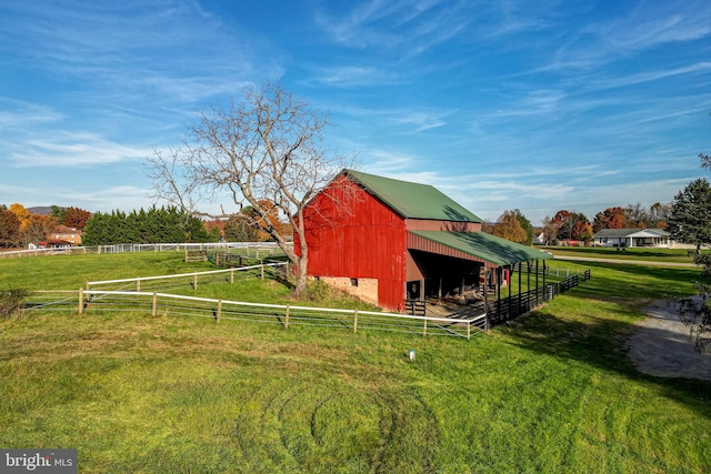 view of outdoor structure with a rural view