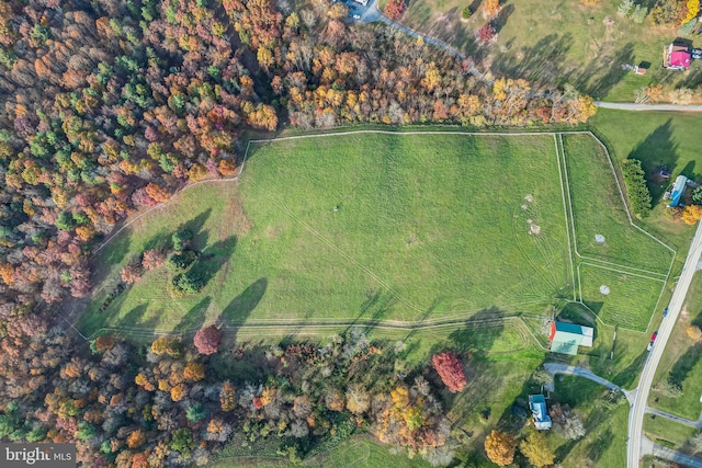 birds eye view of property with a rural view