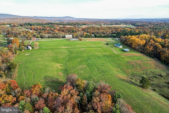 drone / aerial view featuring a mountain view and a rural view