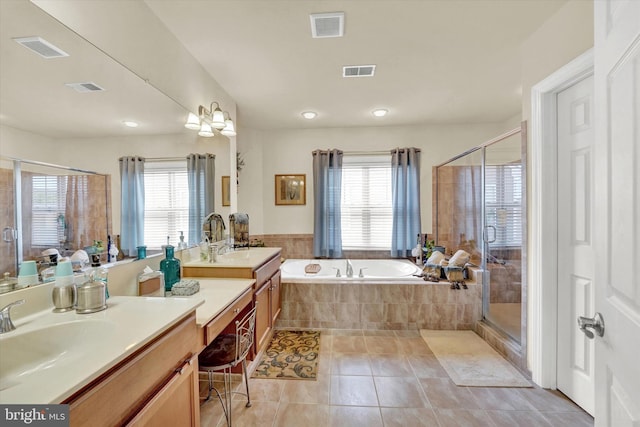 bathroom featuring tile patterned floors, separate shower and tub, and vanity