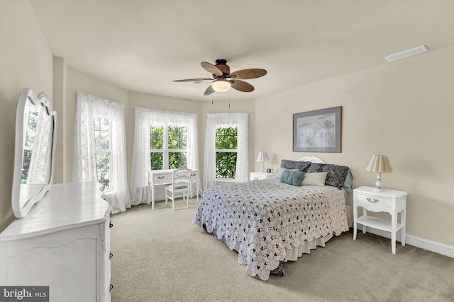 carpeted bedroom featuring ceiling fan