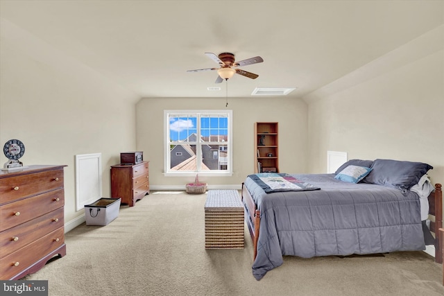 bedroom with vaulted ceiling, ceiling fan, and carpet floors