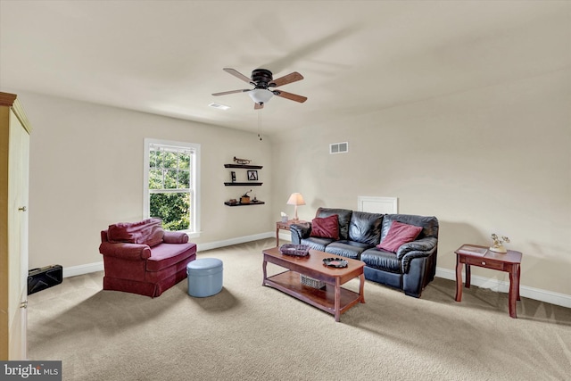 living room with light carpet and ceiling fan