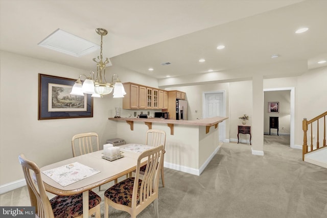 view of carpeted dining space