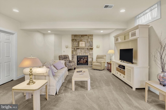 carpeted living room with a fireplace