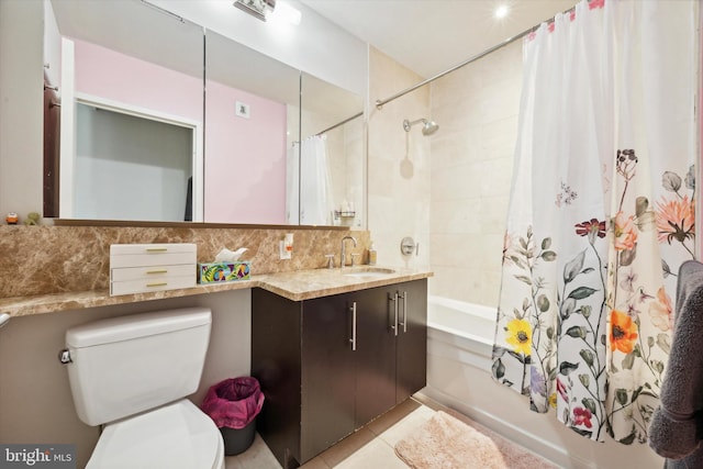 full bathroom featuring tasteful backsplash, tile patterned floors, shower / bath combination with curtain, toilet, and vanity