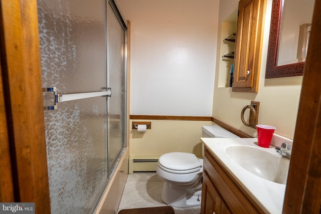 full bathroom featuring combined bath / shower with glass door, tile patterned floors, vanity, a baseboard radiator, and toilet