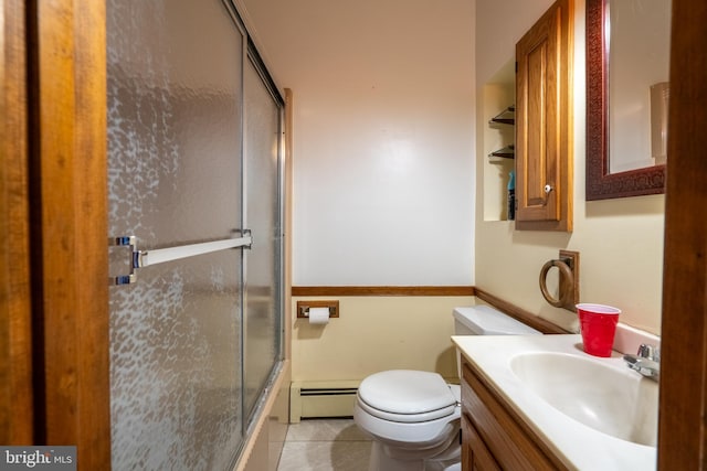 full bathroom featuring a baseboard radiator, tile patterned flooring, enclosed tub / shower combo, toilet, and vanity