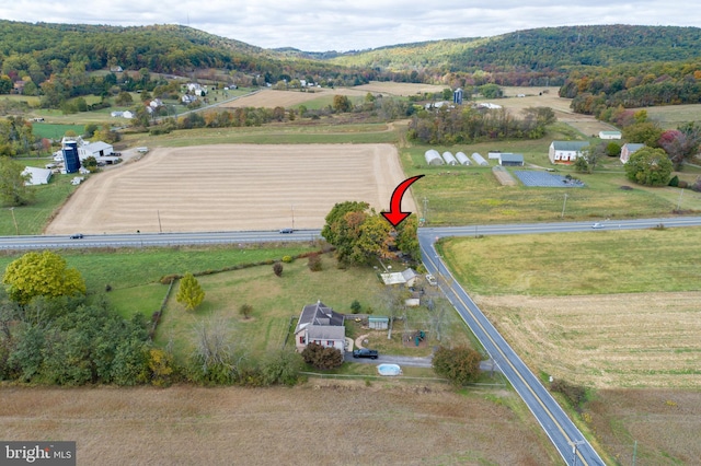 drone / aerial view with a mountain view and a rural view