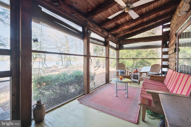 sunroom / solarium featuring vaulted ceiling with beams, ceiling fan, and wooden ceiling