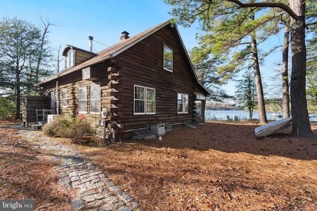 view of side of property with a water view