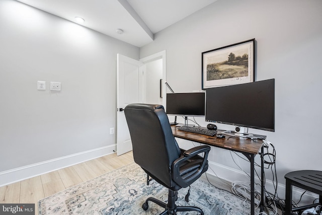 office space with light hardwood / wood-style floors