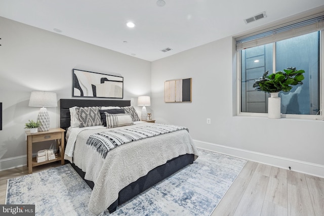 bedroom with light hardwood / wood-style floors