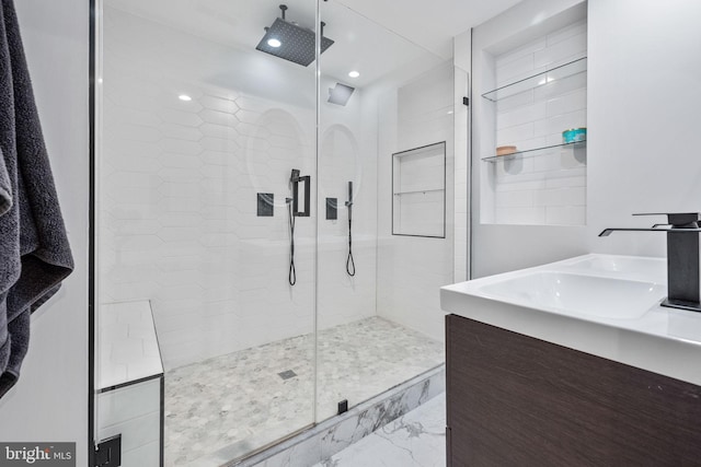 bathroom with vanity and walk in shower