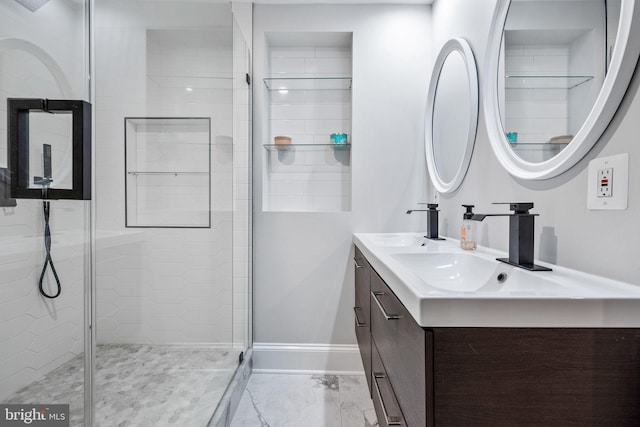 bathroom featuring vanity and a shower with door