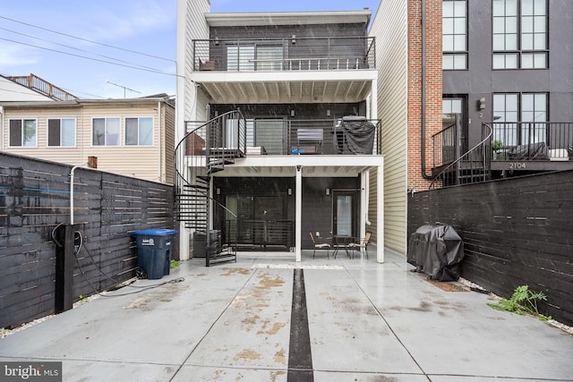 rear view of house with a balcony