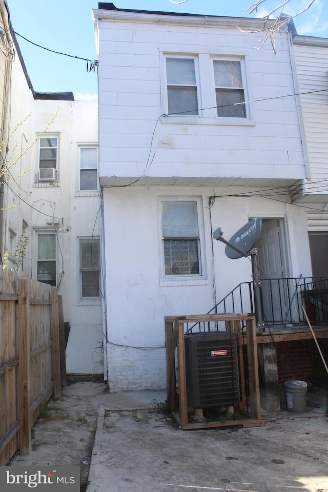 back of house featuring central AC