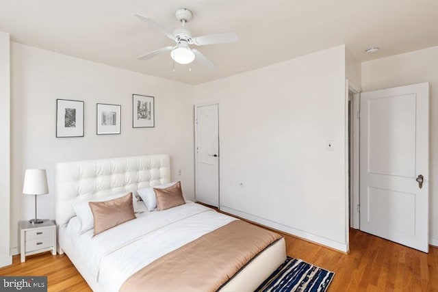 bedroom featuring ceiling fan and hardwood / wood-style flooring