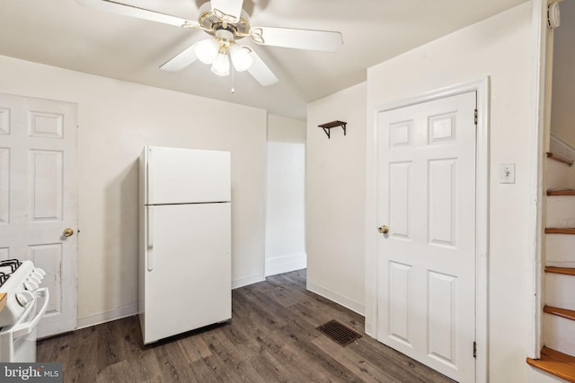 kitchen featuring ceiling fan, white appliances, and dark wood-type flooring