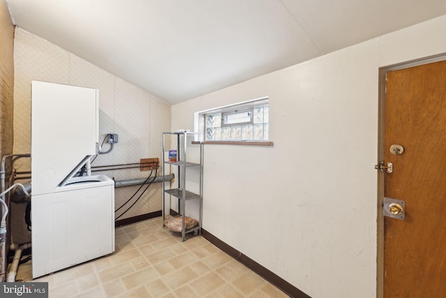 washroom with stacked washer / dryer