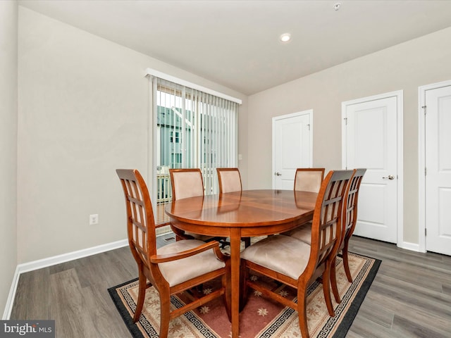 dining area with dark wood-type flooring