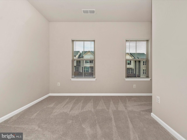 unfurnished room with carpet floors