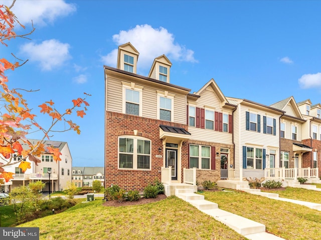 view of property with a front lawn