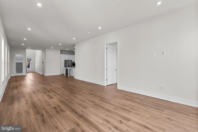 unfurnished living room featuring light hardwood / wood-style flooring