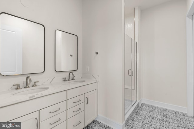 bathroom featuring vanity and a shower with shower door