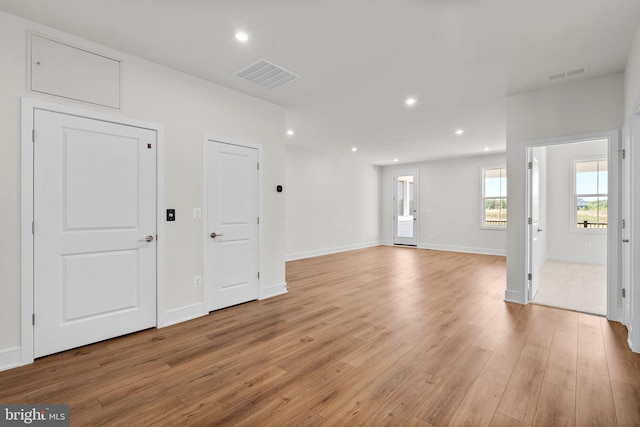 spare room featuring light hardwood / wood-style floors