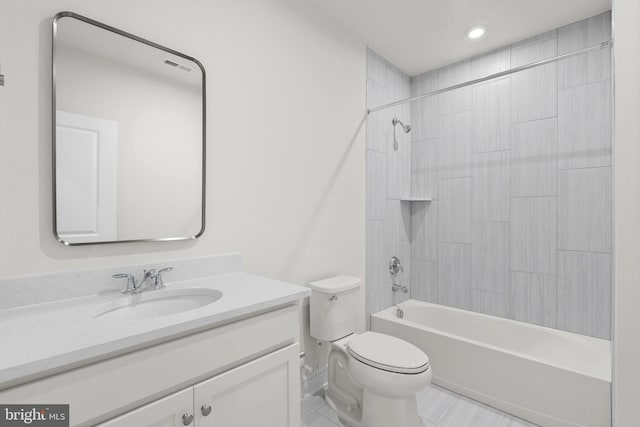 full bathroom with vanity, toilet, and tiled shower / bath