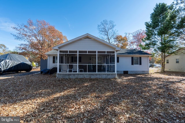 back of house featuring a sunroom