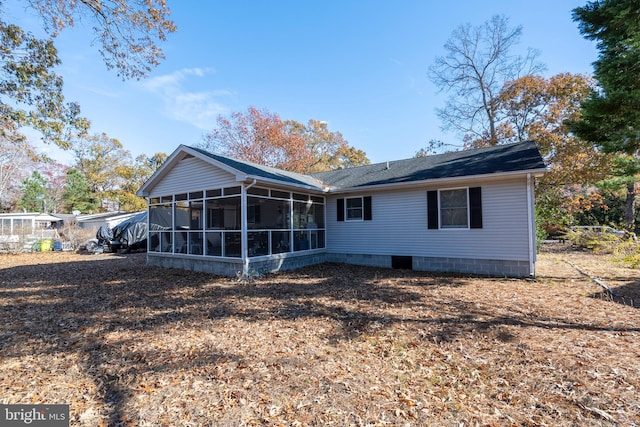 back of property featuring a sunroom