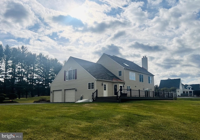 back of house with a lawn and a wooden deck