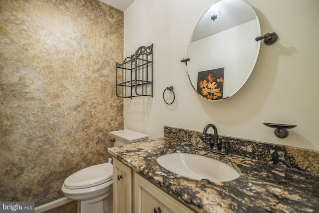 bathroom with vanity and toilet