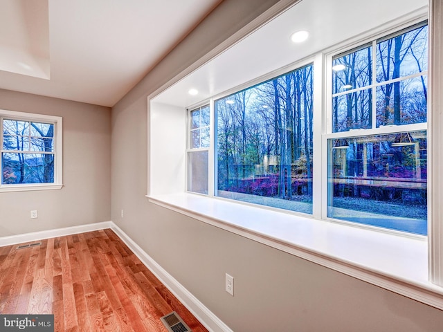 unfurnished room featuring light hardwood / wood-style floors