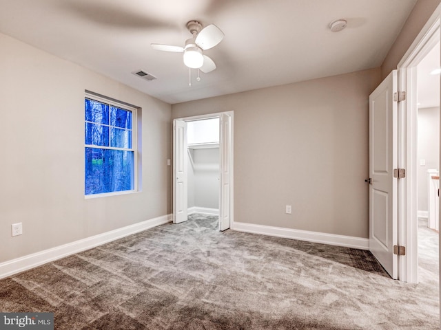 unfurnished bedroom with carpet and ceiling fan