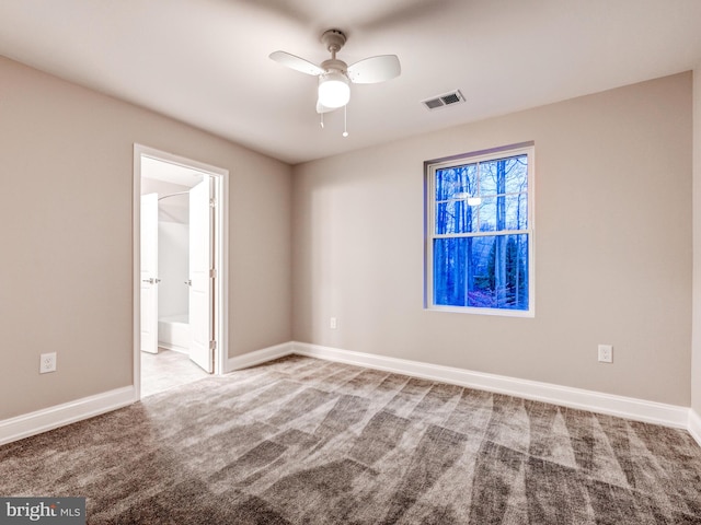 spare room with carpet flooring and ceiling fan