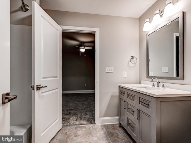 bathroom featuring ceiling fan and vanity