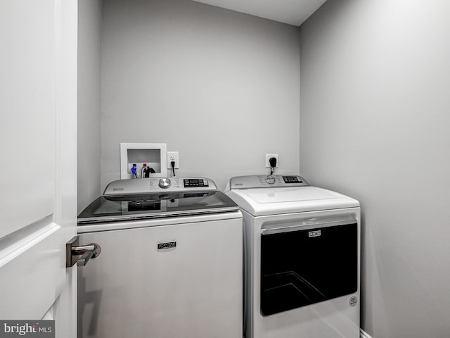 washroom featuring independent washer and dryer