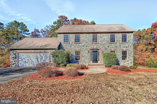 colonial-style house featuring a garage