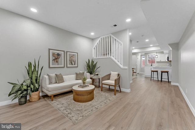 living room with light hardwood / wood-style floors